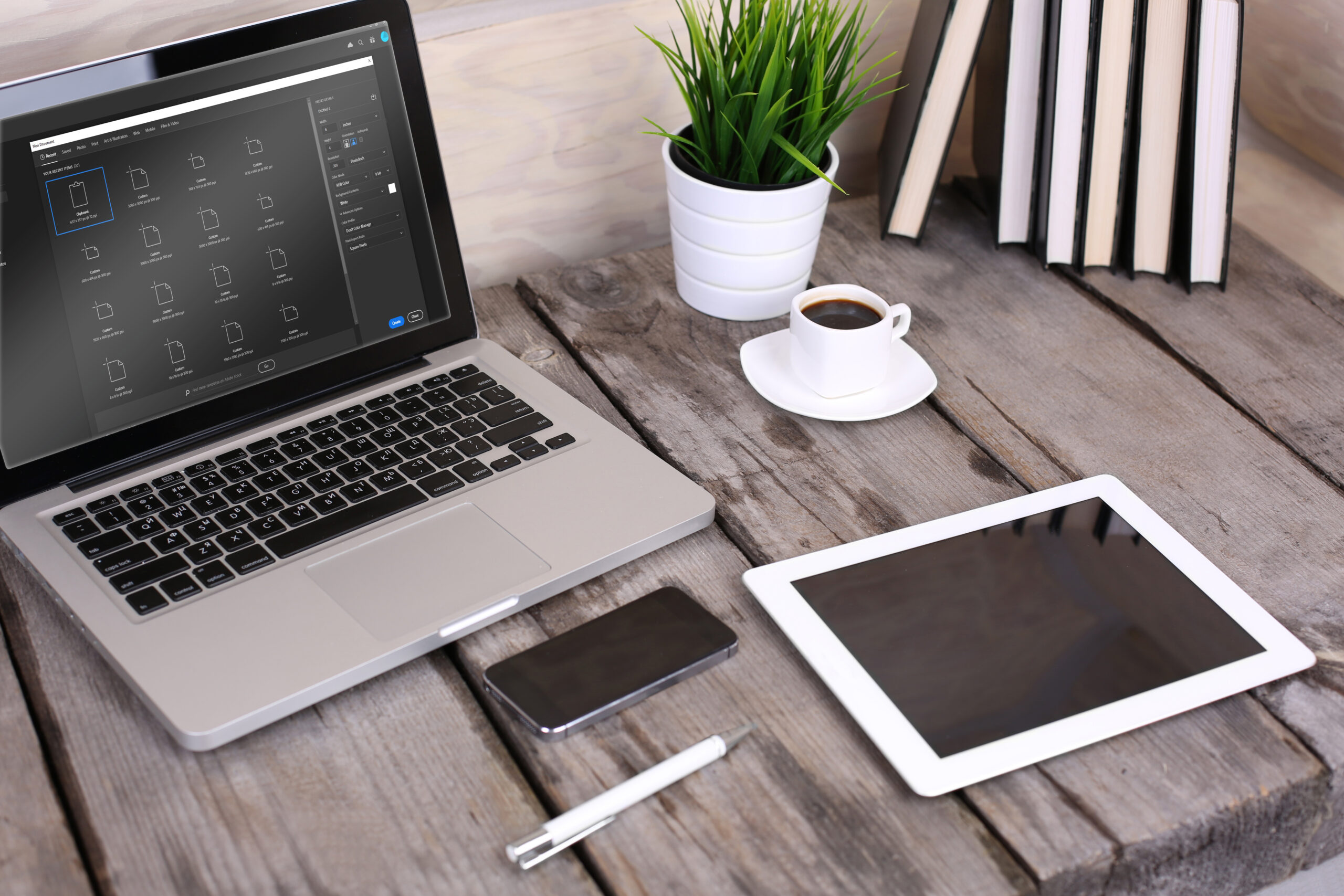 PC laptop, tablet and phone on wooden table